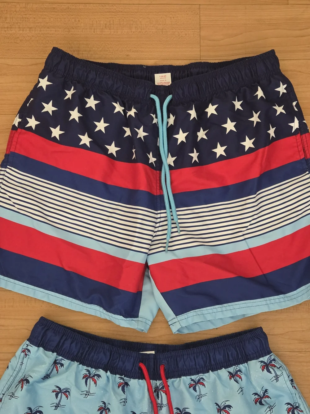 2 Pairs Boys Large Light Blue Palm Print Swim Shorts with Navy & Red Accents